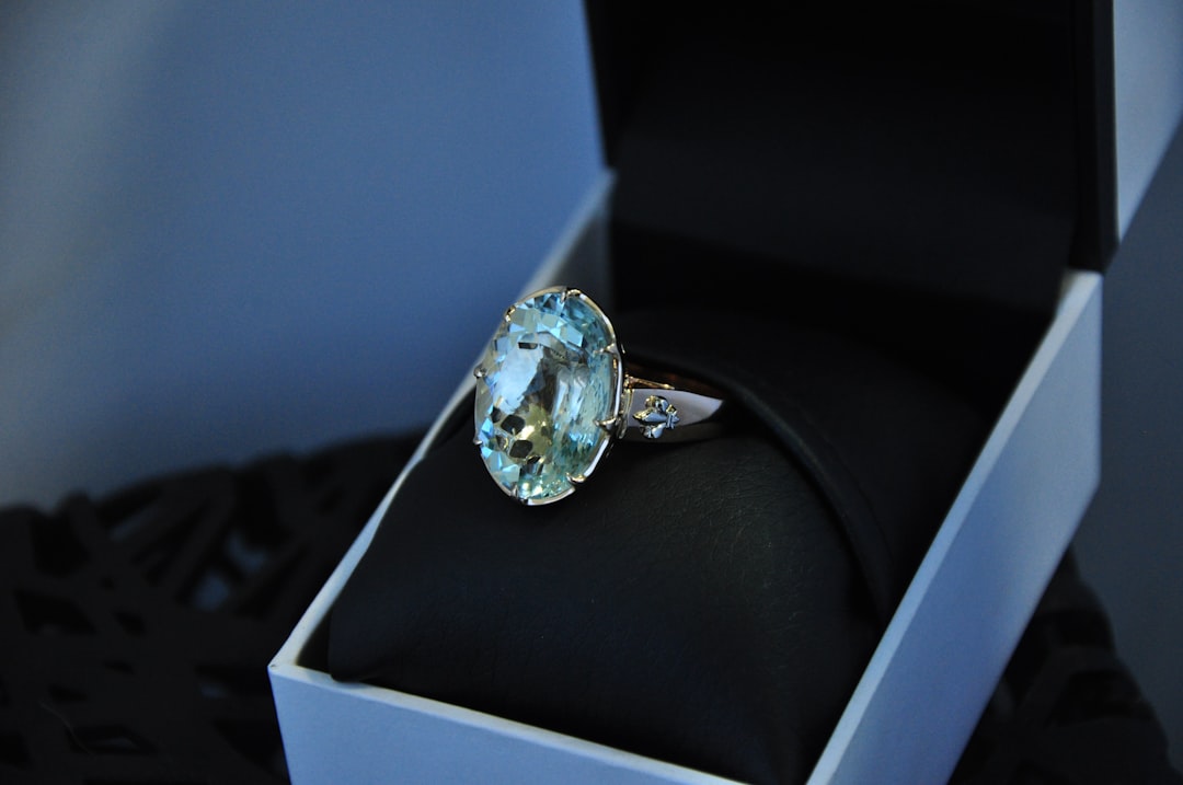 Aquamarine-blue gemstone ring in a jewelry box, a classic love stone for Pisces