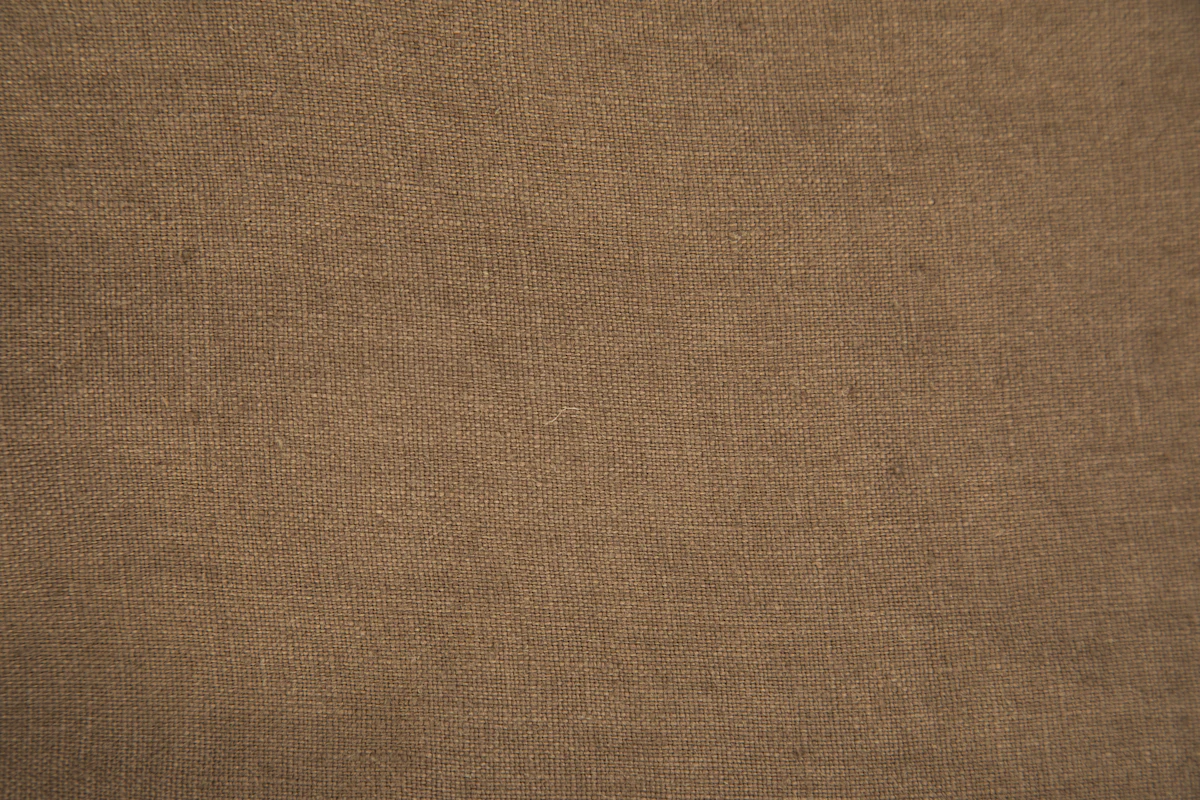 Close-up of brown denim fabric texture