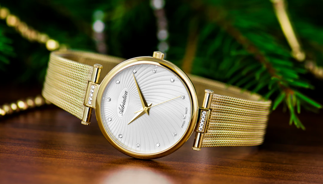 Classic round gold watch — a timeless investment piece for Capricorn women