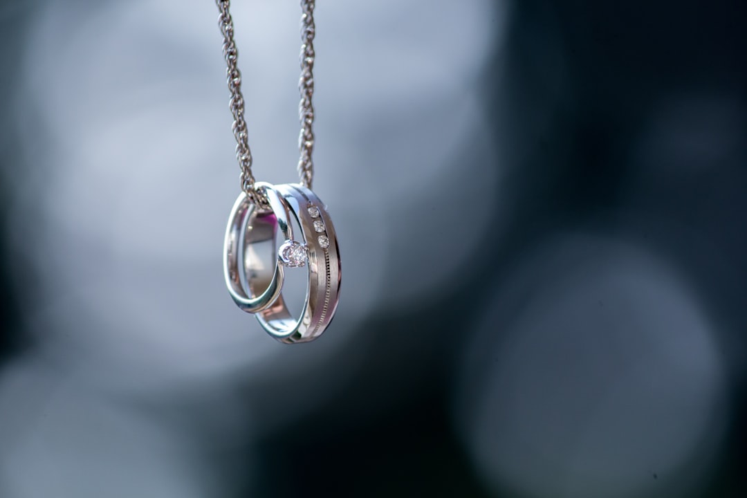 Couple holding hands wearing rings — meaningful jewelry gifts by relationship stage