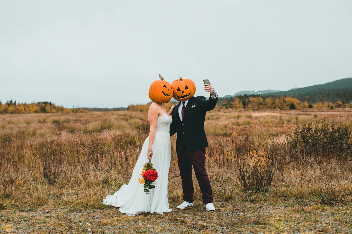 Couple holding pumpkins for an easy DIY Halloween costume