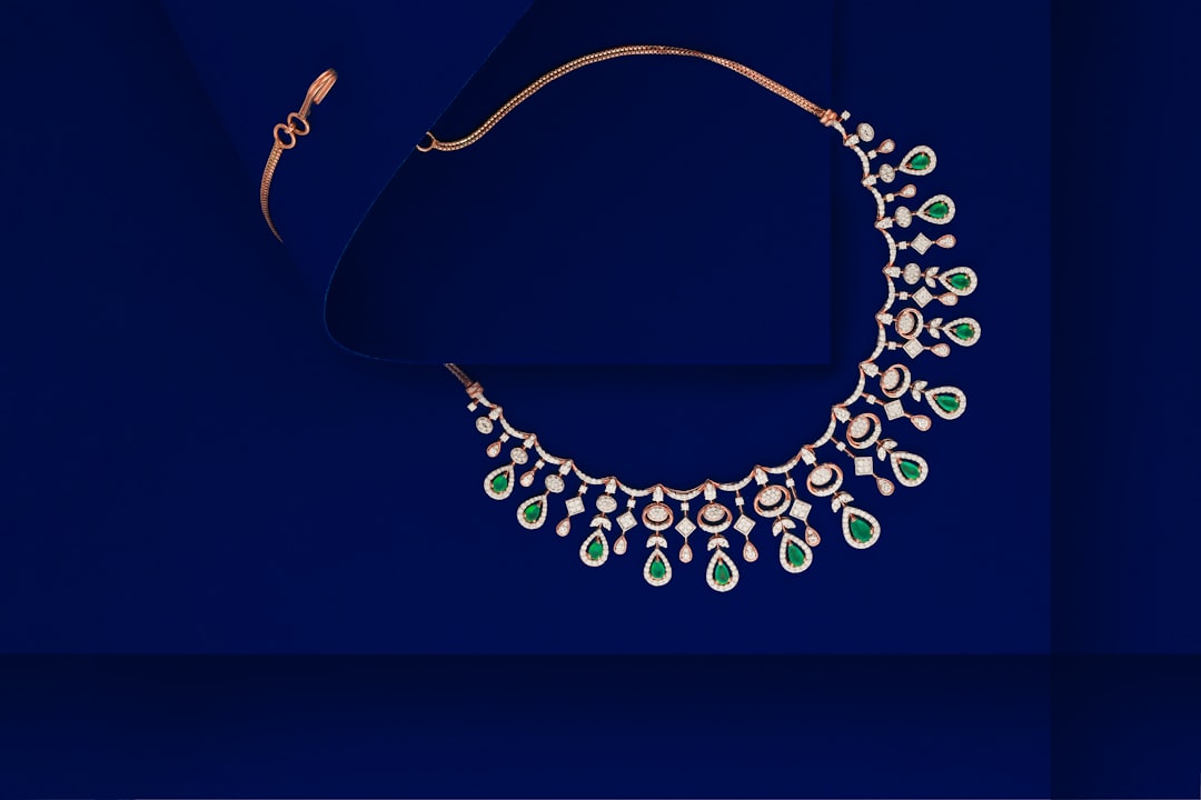 Diamond solitaire necklace and matching diamond stud earrings displayed together