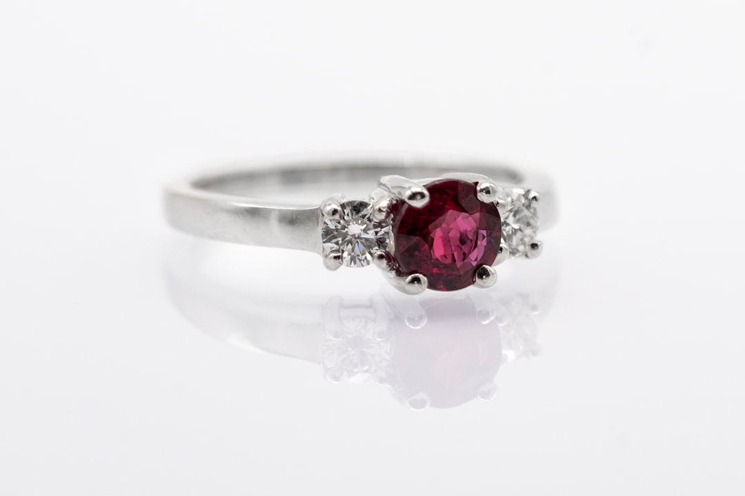 Silver ring set with a deep red garnet gemstone, a passionate love stone for Scorpio