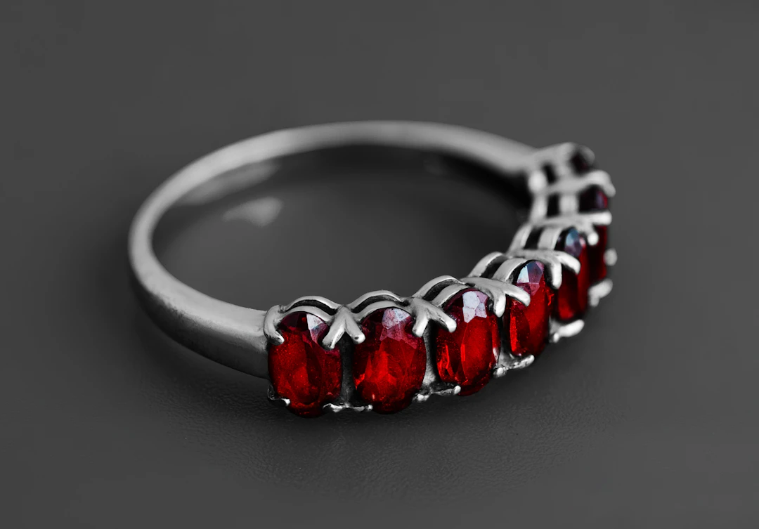 Silver ring set with deep red garnet stones — a signature jewelry gift for Scorpio women
