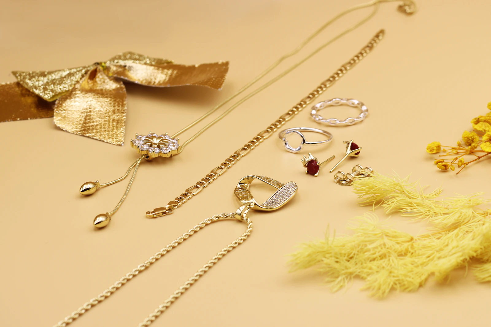 Collection of gold filled and gold plated jewelry laid out on a table for care and storage