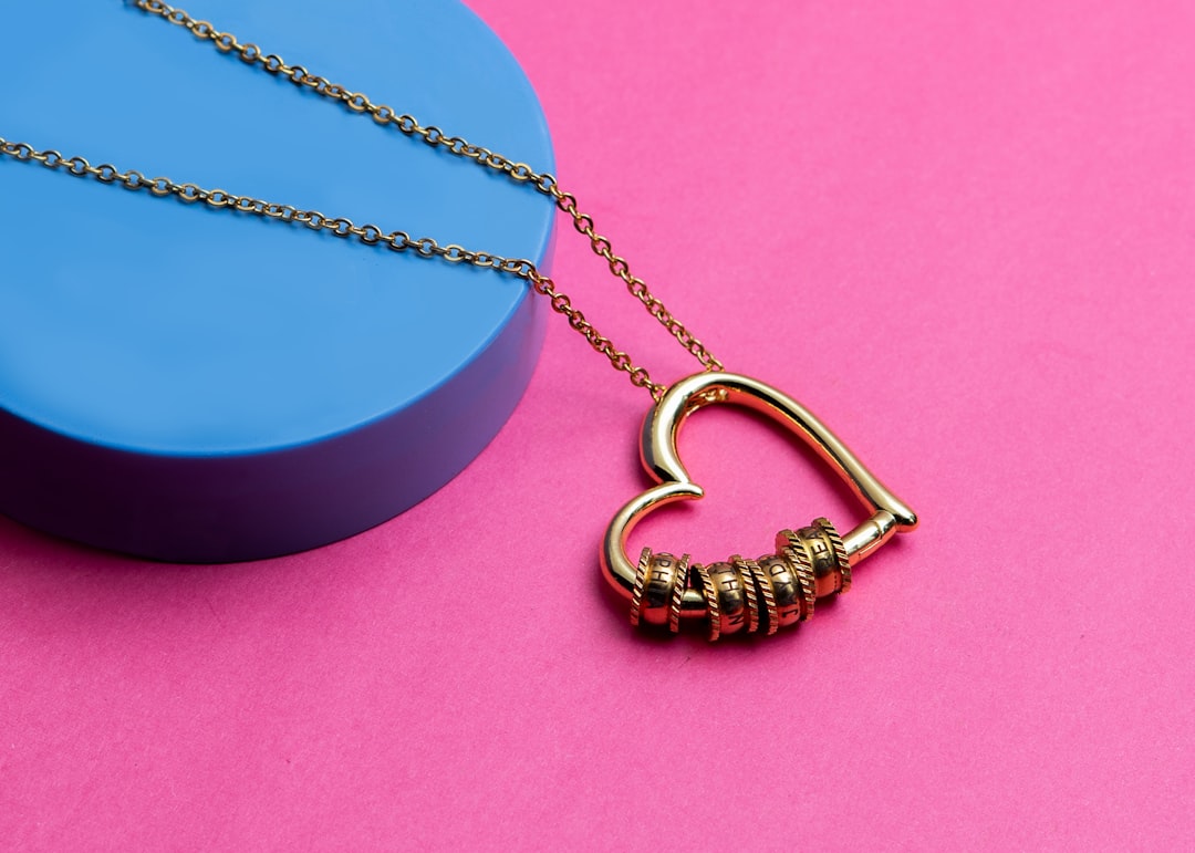 Gold heart pendant necklace with engraved name rings — personalized birthday gift for a girlfriend