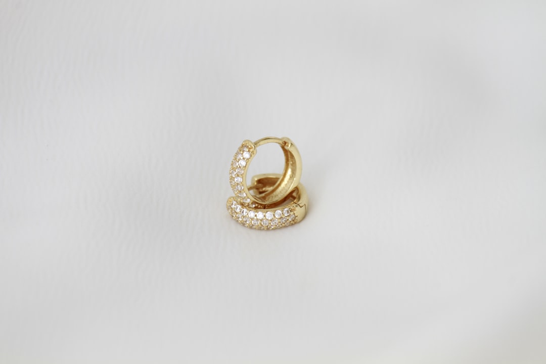 Pair of gold hoop earrings — luxury jewelry gift for women under $500