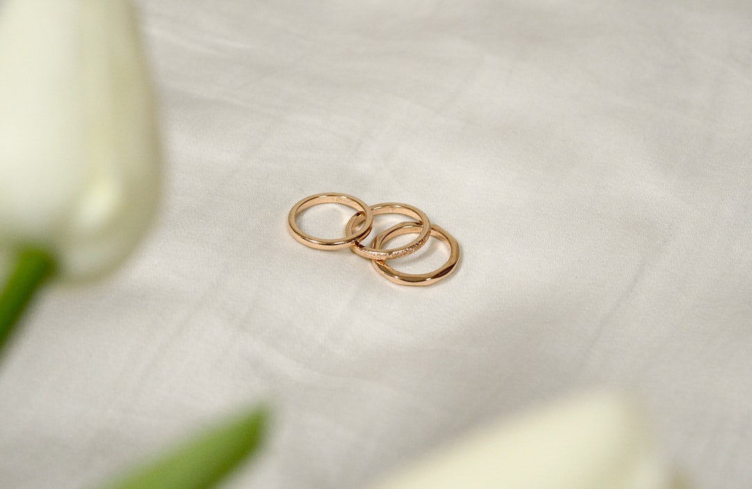 Solid gold ring on white textile — timeless gold jewelry gift under $500