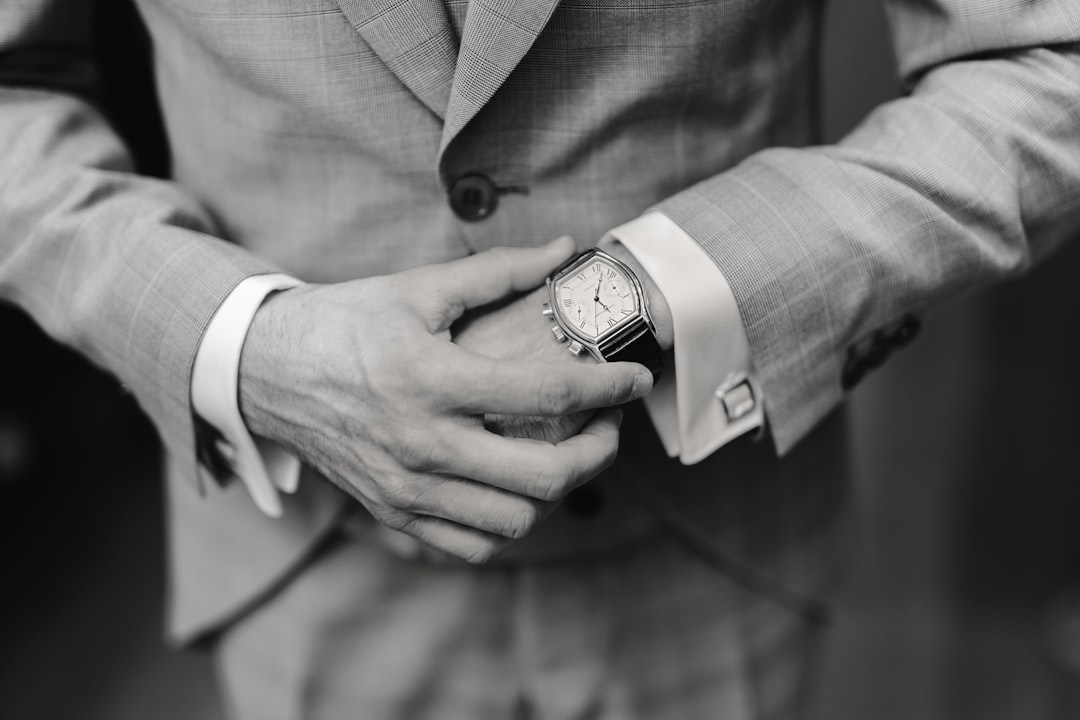 Groom getting ready in his wedding suit — personalized luxury gifts for husbands
