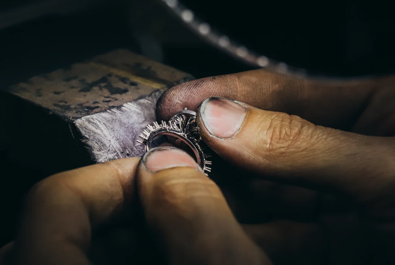 Woman wearing a silver ring on her finger showing correct ring size fit