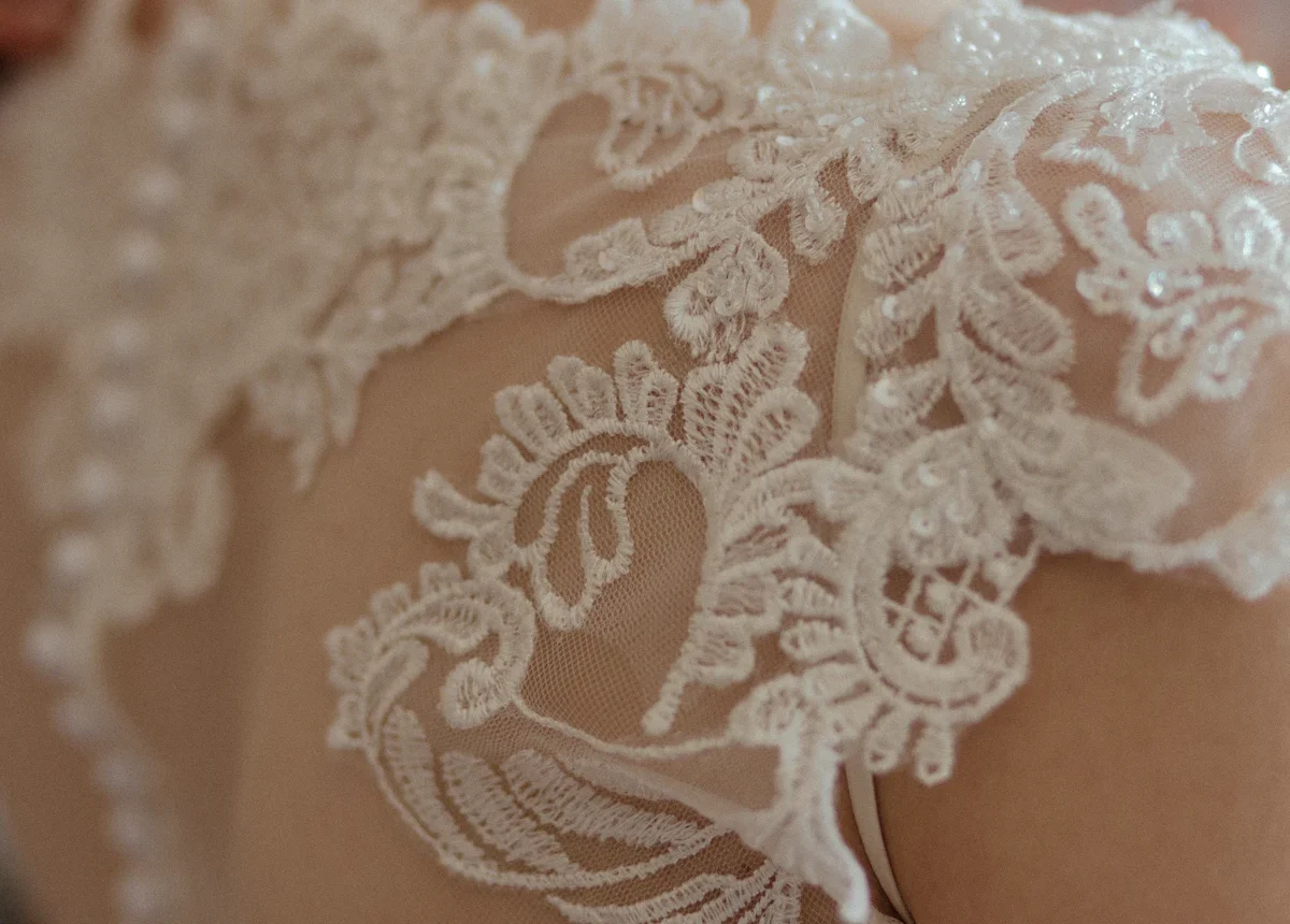 Bride in a white wedding dress learning how to choose the right gown