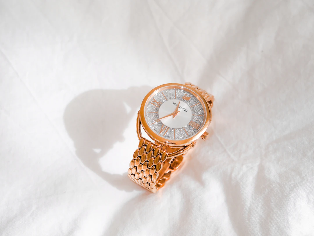 Elegant gold watch and classic styling — timeless investment jewelry for Capricorn women