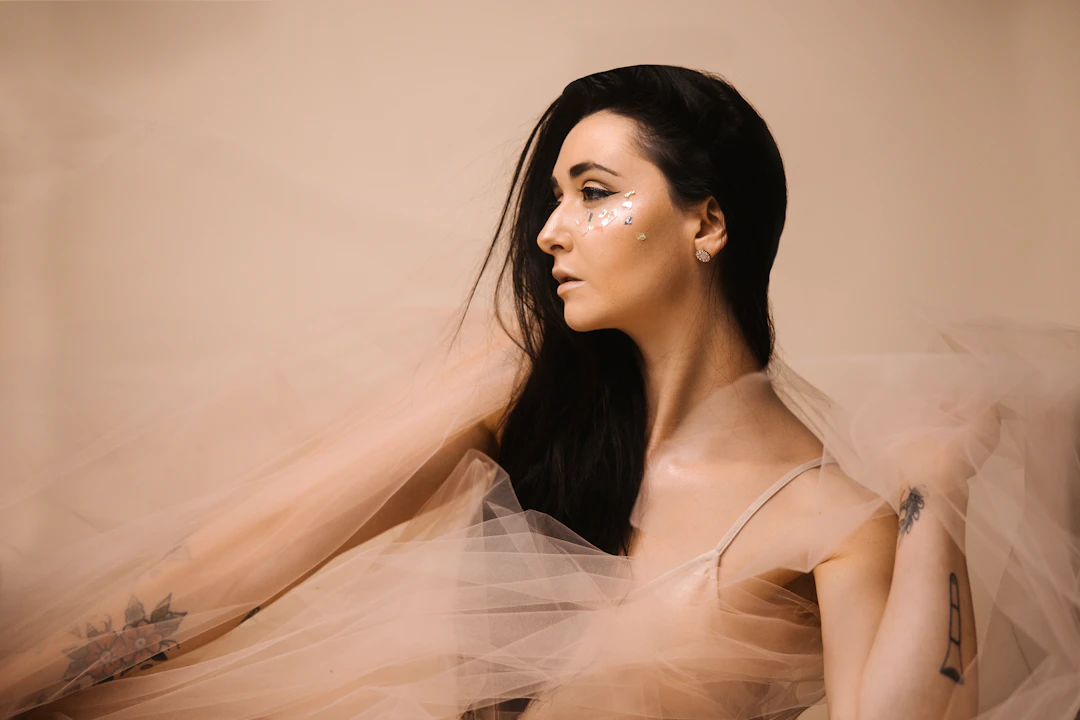 Elegant woman wearing delicate jewelry — refined Venus-ruled gifts for Libra women