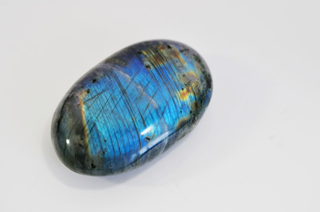 Iridescent labradorite stone flashing blue and gold, an intuition gemstone for Aquarius