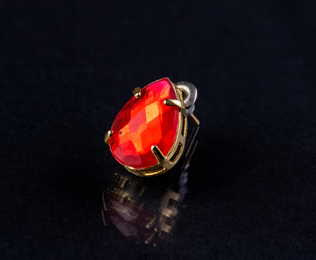 Statement earring with red gemstones — bold fiery jewelry for Aries women