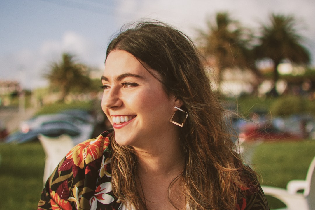 Smiling woman in a floral top — celebrating a 40th birthday with meaningful experiences