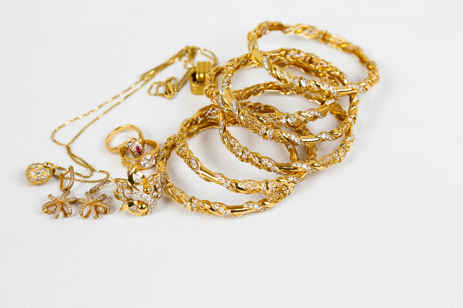 Solid gold jewelry pieces showing the rich color of 18k and 14k gold