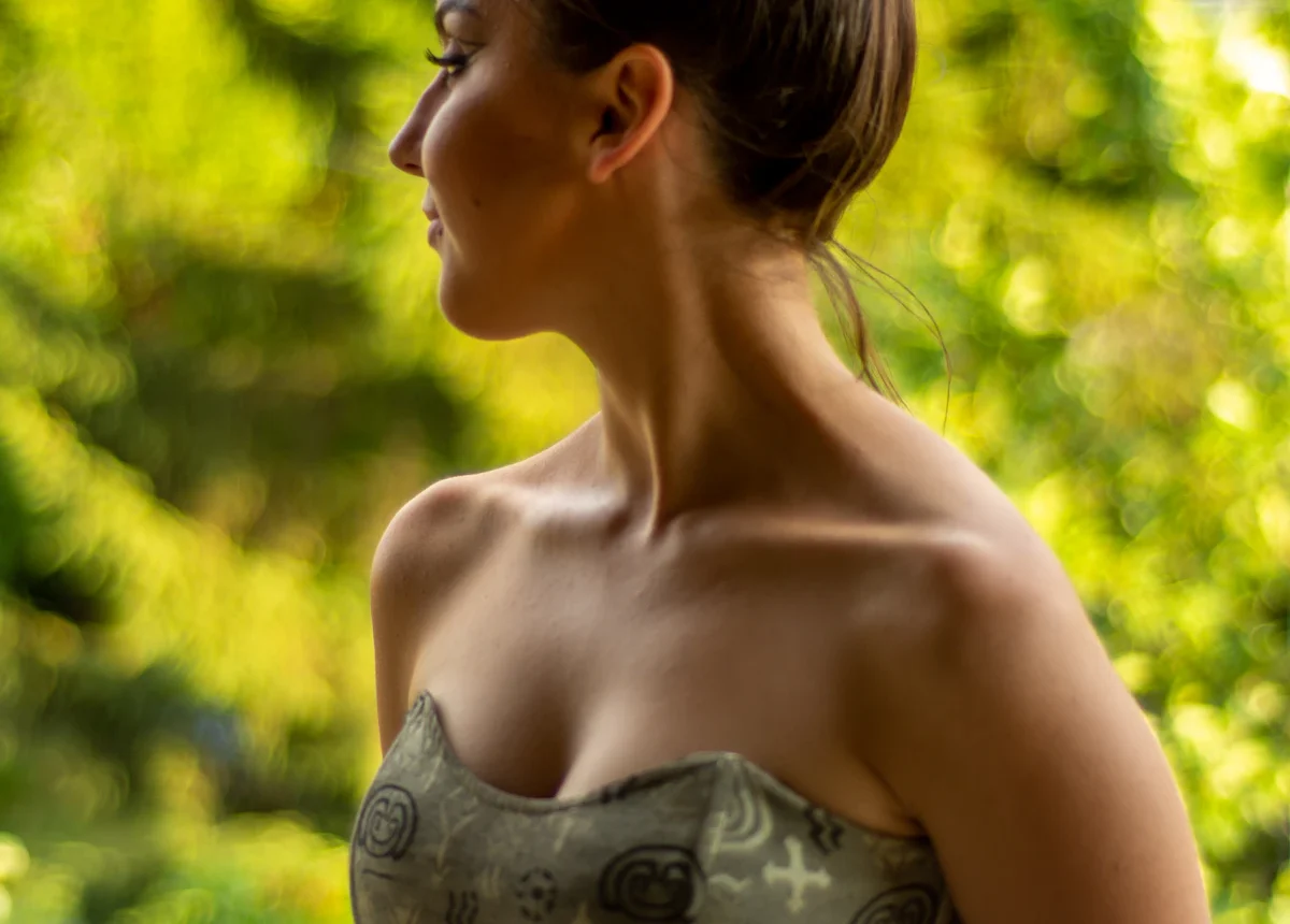 Woman wearing an elegant strapless dress that needs a strapless bra