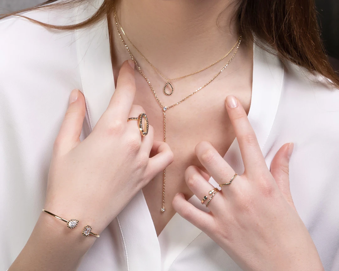 Versatile collection of gold jewelry pieces — mix-and-match styles for Gemini women