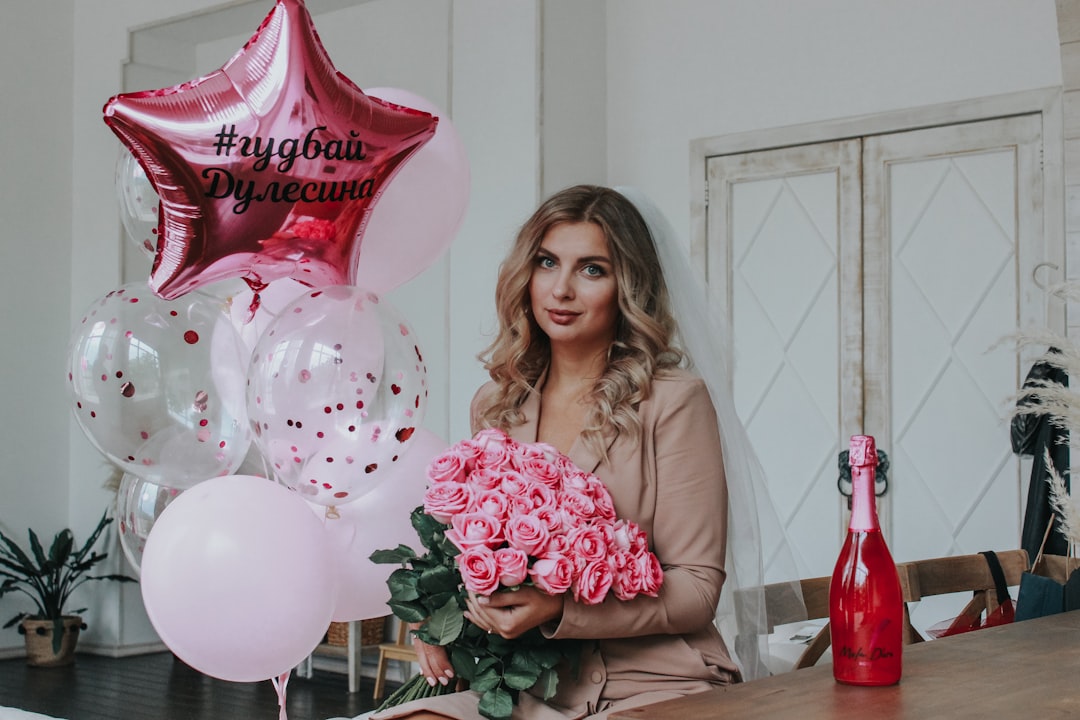 Woman holding a bouquet of flowers — thoughtful 50th birthday experiences and gifts