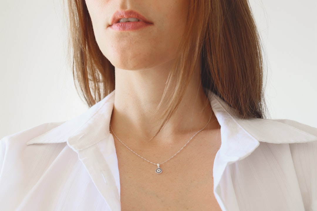 Woman wearing elegant fine jewelry as an everyday self-gifted accessory