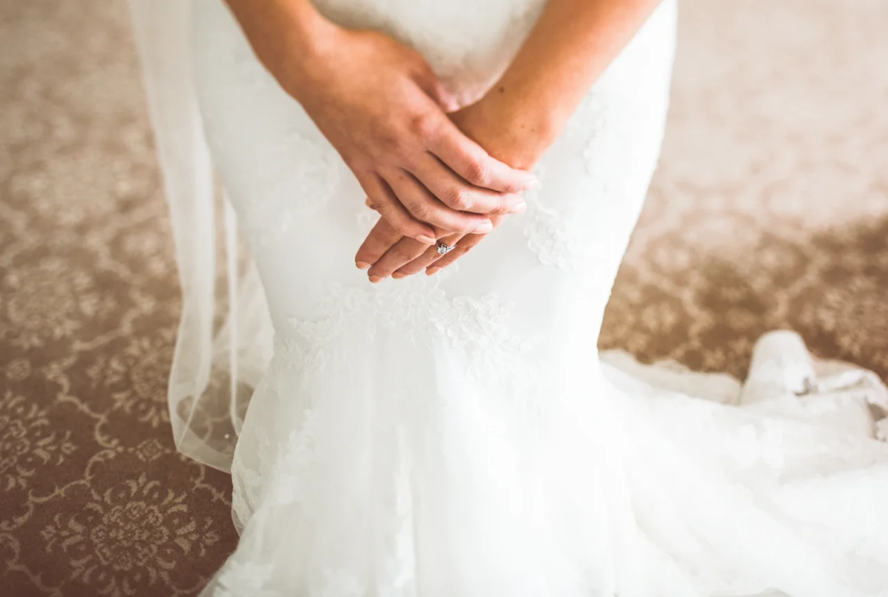 Bride in a wedding dress showing the neckline that determines jewelry choice